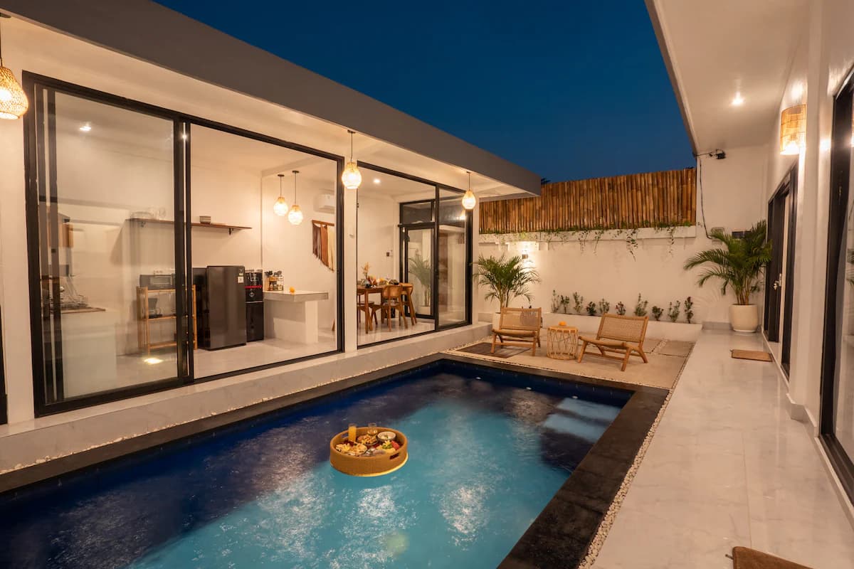 Mas 2 — Pool with floating tray at dusk